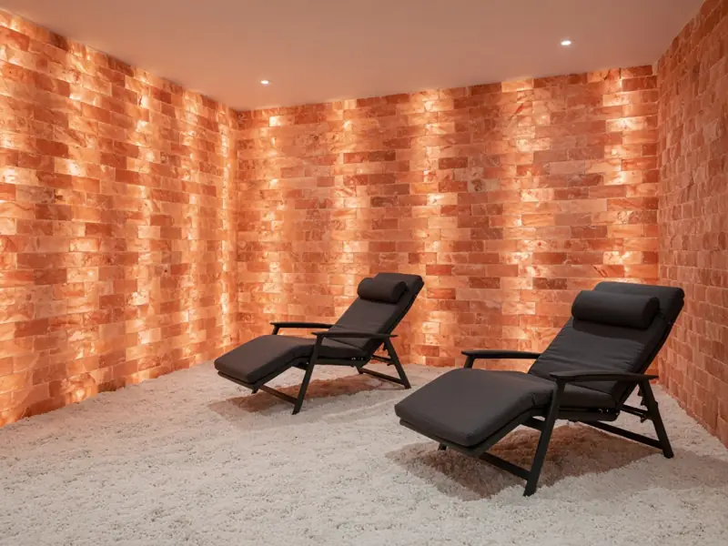 Salt room with backlit pink salt brick walls